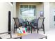 Private patio with table and chairs, perfect for outdoor dining at 4355 Scene Ln, Kissimmee, FL 34746