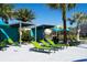 Relaxing pool area with shaded cabanas and lounge chairs at 4355 Scene Ln, Kissimmee, FL 34746