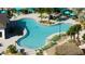 Resort-style pool with surrounding lounge chairs and umbrellas at 4355 Scene Ln, Kissimmee, FL 34746
