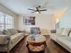 Living room with two sofas, coffee table, and hardwood floors at 5181 Vista Lago Dr, Orlando, FL 32811