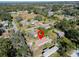 Aerial view of the property surrounded by lush greenery in a quiet neighborhood at 5526 Lily Rd, Lakeland, FL 33811
