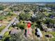 Aerial view of the property surrounded by lush trees in a peaceful neighborhood at 5526 Lily Rd, Lakeland, FL 33811