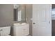 Bathroom with white vanity and toilet at 5526 Lily Rd, Lakeland, FL 33811