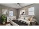 Cozy bedroom features neutral paint, a comfortable bed, and modern decor at 5526 Lily Rd, Lakeland, FL 33811
