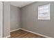Simple bedroom with wood-look floors and window at 5526 Lily Rd, Lakeland, FL 33811