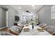 Bright dining area features a marble table, modern chairs, and an open concept layout at 5526 Lily Rd, Lakeland, FL 33811