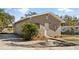 Updated home with a paved driveway and manicured landscaping at 5526 Lily Rd, Lakeland, FL 33811