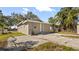 Single-story home with a paved driveway at 5526 Lily Rd, Lakeland, FL 33811
