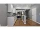 Renovated kitchen with white shaker cabinets and stainless steel appliances at 5526 Lily Rd, Lakeland, FL 33811