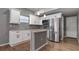 Modern kitchen featuring white cabinets, stainless steel appliances, and granite countertops at 5526 Lily Rd, Lakeland, FL 33811