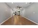 Open concept living area with hardwood floors and ceiling fan at 5526 Lily Rd, Lakeland, FL 33811