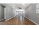 Spacious living room featuring hardwood floors and neutral walls at 5526 Lily Rd, Lakeland, FL 33811
