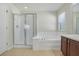 Bathroom with shower, tub, and double vanity at 7343 Derexa Dr, Windermere, FL 34786