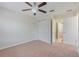 Bedroom with double door closet and access to hallway at 7343 Derexa Dr, Windermere, FL 34786