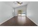 Bright bedroom with dark brown tile floors and sliding glass doors leading to the pool at 1027 Sweetbrook Way, Orlando, FL 32828