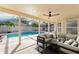 Relaxing covered patio overlooking a sparkling pool, perfect for outdoor living at 1027 Sweetbrook Way, Orlando, FL 32828