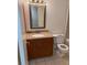 Bathroom featuring a toilet, vanity with a granite countertop and framed mirror at 11538 Westwood Blvd # 226, Orlando, FL 32821