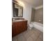 Functional bathroom with granite countertop vanity and a shower-tub combination at 11538 Westwood Blvd # 226, Orlando, FL 32821