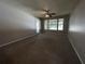 Bright bedroom with window, ceiling fan and neutral carpet at 11538 Westwood Blvd # 226, Orlando, FL 32821