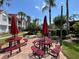 Community picnic area with grills and red picnic tables at 11538 Westwood Blvd # 226, Orlando, FL 32821