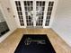 Building entrance featuring a 'Lexington Place' welcome mat and glass doors at 11538 Westwood Blvd # 226, Orlando, FL 32821