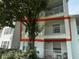 Three story condo featuring a tree and balconies at 11538 Westwood Blvd # 226, Orlando, FL 32821