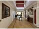 Hallway with tile flooring, framed art, and natural lighting at 11538 Westwood Blvd # 226, Orlando, FL 32821