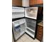 The refrigerator's interior shows ample storage space in this unit's kitchen at 11538 Westwood Blvd # 226, Orlando, FL 32821