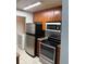 This kitchen has stainless steel appliances and ample cabinet space at 11538 Westwood Blvd # 226, Orlando, FL 32821