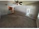Spacious living room with neutral carpet and access to patio at 11538 Westwood Blvd # 226, Orlando, FL 32821