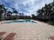 Community pool with lounge chairs and patio area at 11538 Westwood Blvd # 226, Orlando, FL 32821