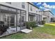 Private backyard with screened patio and lawn at 12067 White Wave Pt, Orlando, FL 32828