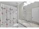 Bathroom with toilet, vanity with granite countertop, and shower at 12067 White Wave Pt, Orlando, FL 32828