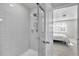 Shower with glass enclosure and white subway tile at 12067 White Wave Pt, Orlando, FL 32828