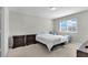 Second bedroom with carpeted floor, window, and two nightstands at 12067 White Wave Pt, Orlando, FL 32828