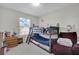 bedroom with bunk beds, sitting area, and window at 12067 White Wave Pt, Orlando, FL 32828