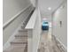 Entryway with carpeted stairs and wood-look tile flooring at 12067 White Wave Pt, Orlando, FL 32828