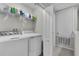 Bright laundry room with washer, dryer, and storage at 12067 White Wave Pt, Orlando, FL 32828