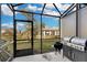 Screened patio with grill and view of community at 12067 White Wave Pt, Orlando, FL 32828