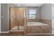 Bathroom with a shower and garden tub at 12273 Great Commission Way, Orlando, FL 32832