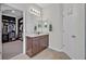 Bathroom with vanity, walk-in closet access, and tiled floor at 124 Adler Pt, Oviedo, FL 32765