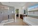 Spa-like bathroom featuring a soaking tub and walk-in shower at 124 Adler Pt, Oviedo, FL 32765