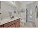 Bathroom with single vanity, toilet, and shower access at 124 Adler Pt, Oviedo, FL 32765
