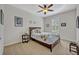 Bright bedroom with a queen bed and window with plantation shutters at 124 Adler Pt, Oviedo, FL 32765