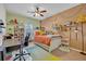 Bright bedroom with built-in shelves and a comfortable bed at 124 Adler Pt, Oviedo, FL 32765