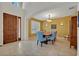 Bright dining room with a wood table and blue patterned chairs at 124 Adler Pt, Oviedo, FL 32765