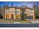 Two-story house with a landscaped lawn and a three-car garage at 124 Adler Pt, Oviedo, FL 32765