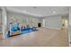 Spacious home gym with a treadmill, weights, and exercise mat at 124 Adler Pt, Oviedo, FL 32765