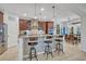 Island kitchen with granite countertops, stainless steel appliances, and ample cabinetry at 124 Adler Pt, Oviedo, FL 32765