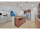 Open concept kitchen with large island, granite countertops, and stainless steel appliances at 124 Adler Pt, Oviedo, FL 32765